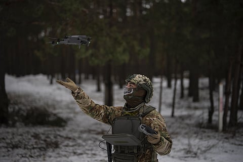 A Ukrainian serviceman lands a drone during a demonstration close to the border with Belarus. (Photo | AP)