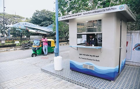 An autorickshaw waits for customers at a prepaid auto stand near the Cubbon Park Metro station on Thursday | VINOD kumar t