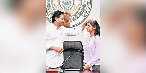  CM Jagan blessing a student during the launch of Jagananna Videshi Vidya Deevena programme at his camp office on Friday | Express 