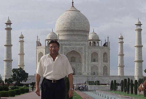 Pakistan President Pervez Musharraf poses for photographers in front of the historic Taj Mahal in the northern Indian city of Agra. (2001 File Photo | PTI)