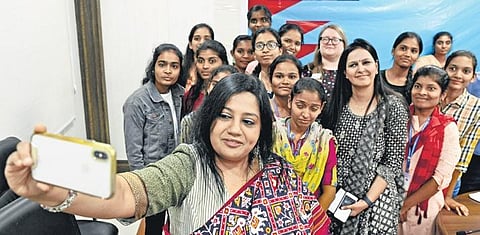 Janaka Pushpanathan, director of south India region, British Council, takes a selfie with the selected candidates; Vinay Madapu