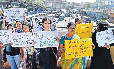 Volunteers of Bus Prayanikara Vedike hold placards of a campaign ‘Better BMTC for Better Bengaluru’, at Majestic Bus Stand in Bengaluru on Saturday | Shashidhar Byrappa