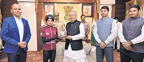 Governor Biswabhusan Harichandan felicitating Aasha Malviya with a momento at Raj Bhavan on Sunday | Express