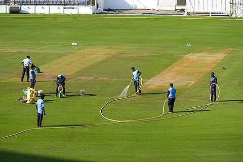 Groundsmen work at Vidarbha Cricket Association Stadium (VCA) Jamtha ahead of the first Test between India and Australia, in Nagpur, on Monday. The first match of the four-Test series begins.