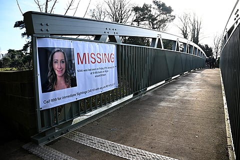 A banner asking for information on missing Nicola Bulley is pictured on a bridge in St Michael's on Wyre, north west England on Feb 6, 2023, as the search for her continues. (Photo | AFP)
