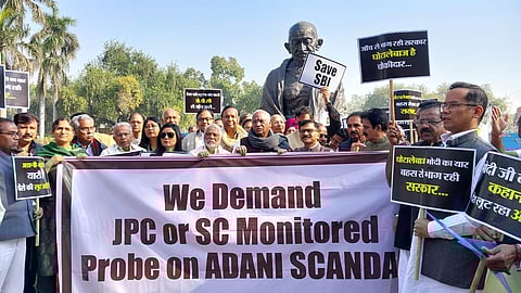 Opposition MPs protest on Adani issue at Gandhi Statue in Parliament House, in New Delhi (Photo | Shekhar Yadav, EPS)
