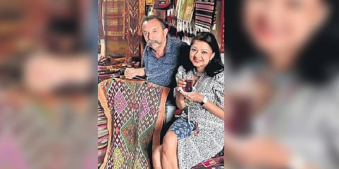 Anupamaa (right) enjoying a glass of tea amid vintage Anatolian killims in Turkey