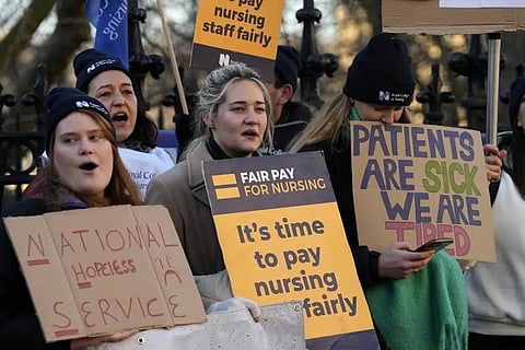 Nurses of the nearby St. Thomas' Hospital stand on the picket line, in London, Monday, Feb. 6, 2023. (Photo | AP)