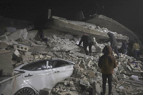 People search a collapsed building following an earthquake in Azmarin town, Idlib province, northern Syria, Monday, Feb. 6, 2023. (Photo | AP)