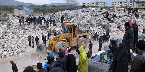 Residents and rescuers search for victims and survivors amidst the rubble of collapsed buildings following the earthquake. (Photo | AFP)