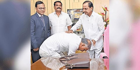 Finance Minister T Harish Rao takes the blessings of Chief Minister K Chandrasekhar Rao before presenting the Budget on Monday.