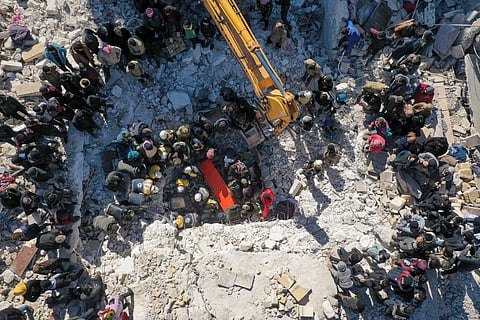 Rescuers searching the rubble of buildings for casualties and survivors in Syria's northwestern Idlib province at the border with Turkey, Feb. 7, 2023. (Photo | AFP)