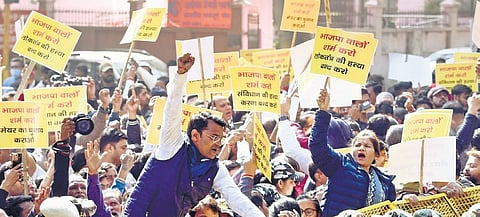 AAP leaders attempt to cross police barricades during a protest near the BJP headquarters over the delay in MCD Mayor’s election in New Delhi on Tuesday | Parveen Negi