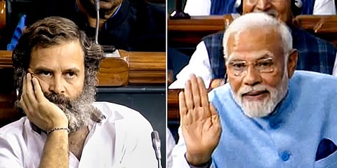 PM Narendra Modi replies to the Motion of Thanks on the President's Address as Congress MP Rahul Gandhi listens to him in the Lok Sabha, Feb. 8, 2023. (Photo | PTI)