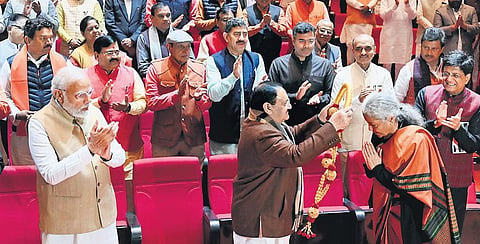 Finance Minister Nirmala Sitharaman felicitated by BJP president JP Nadda as PM Modi looks on at the BJP Parliamentary Party meet in New Delhi on Tuesday | Shekhar Yadav