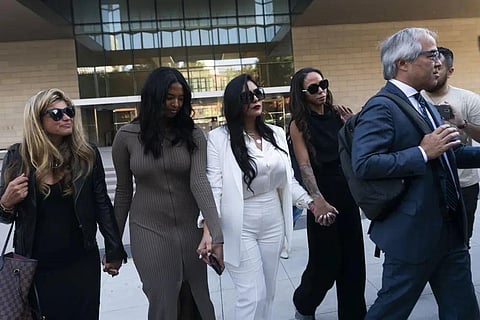 Vanessa Bryant, center, leaves a federal courthouse with her daughter Natalia, center left, soccer player Sydney Leroux, center right, in Los Angeles, Aug. 24, 2022. (File Photo | AP)