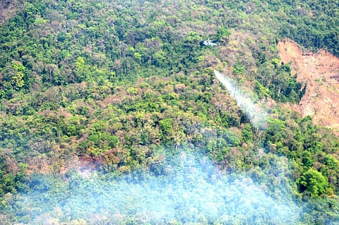 Indian Navy helicopters dousing fires in Goa's Mhadei wildlife sanctuary. (Photo | Goa Naval Area Twitter)