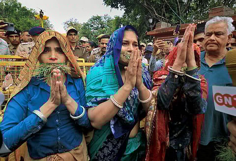 Widows of Pulwama attack victims Rohitash Lamba, Jeetram Gurjar and Hemraj Meena with MP Kirori Lal Meena with MP Kirori Lal Meena during a protest against Rajasthan Chief Minister Ashok Gehlot. (PTI)