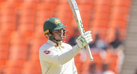 Australia's Usman Khawaja raises his bat after scoring one hundred and fifty runs during the second day of the fourth cricket test match between India and Australia in Ahmedabad.(Photo | PTI)