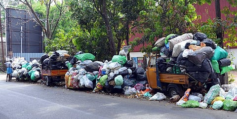 Waste wrapped in bags piled up on Thammanam- Palarivattom road. Garbage collection by Kochi Corporation has been halted for more than a week.