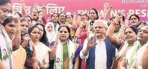BSR leader K Kavitha and CPI (M) general secretary Sitaram Yechury during a hunger strike seeking the passage of the long-pending Women’s Reservation Bill in the Budget session of Parliament