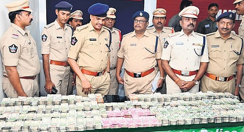 Anantapur district Superintendent of Police Fakeerappa Kaginelli police with the seized `1.89 crore cash at a press meet held on Friday | Express