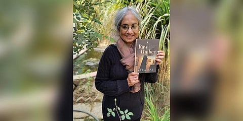 Author Sara Rai with her book 'Raw Umber' which is a tribute to Munshi Premchand and his clan. (Photo | Amazon website)
