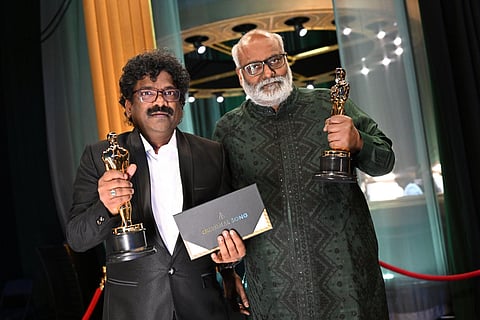 Composer MM Keeravaani and lyricist Chanrabose hold the Oscar for Best Music (Original Song) for their song 'Naatu Naatu' at the Dolby Theatre in Hollywood, March 12, 2023. (Photo | AFP)