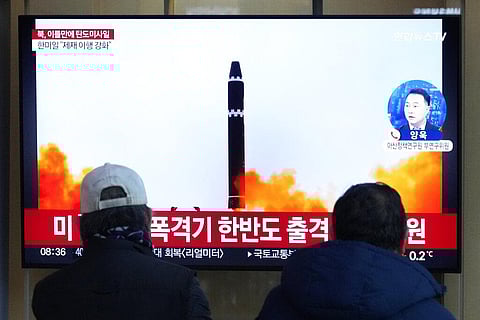 A TV screen shows a file image of North Korea's missile launch during a news program. (Photo | AP)