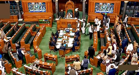 New Delhi: Opposition MPs protest in the well of the Lok Sabha during Budget Session of Parliament, in New Delhi. (File Photo | PTI)