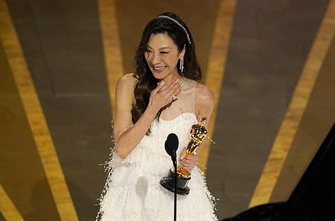 Michelle Yeoh accepts the award for best performance by an actress in a leading role for 'Everything Everywhere All at Once' at the Oscars on March 12, 2023. (Photo | AP)