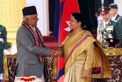 Outgoing President Bidhya Devi Bhandari, right, congratulates Nepal's newly elected president Ram Chandra Poudel, after he took the oath of office at the presidential building. (Photo | PTI)