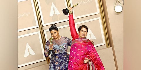 (L-R) Kartiki Gonsalves and Guneet Monga, winners of the Best Documentary Short Subject award for 'The Elephant Whisperers,' pose during the 95th Annual Academy Awards on March 12. (Photo | AFP)