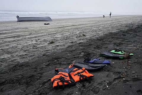 A boat sits overturned near a row of life jackets on Blacks Beach, Sunday, March 12, 2023, in San Diego. (Photo | AP)