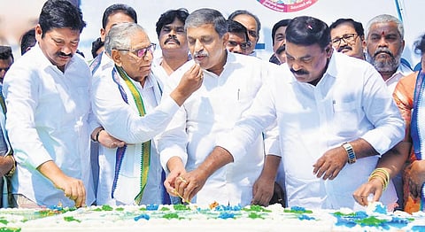 YSRC general secretary Sajjala Ramakrishna Reddy cuts the cake at the 13th Formation Day celebrations of the party in Mangalagiri on Sunday I Express