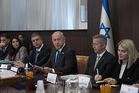Israel's Prime Minister Benjamin Netanyahu, center, makes opening remarks at the weekly cabinet meeting in Jerusalem, Sunday, March 12, 2023. (Photo | AP)