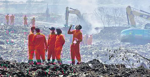 Firefighters during the last stage of operations at Brahmapuram | A Sanesh