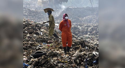 Fire fighters during the last stage of operations at Brahmapuram .Express.( Photo by A Sanesh)