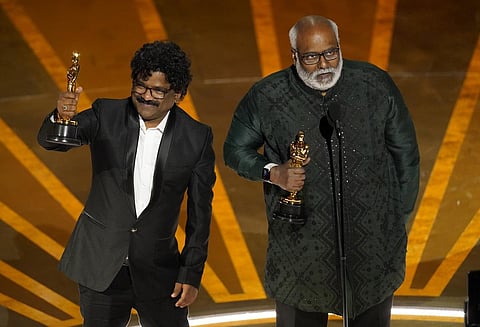 M M Keeravaani (right) and Chandrabose accept the award for best original song for 'Naatu Naatu' from 'RRR' at the Oscars. (Photo | AP)