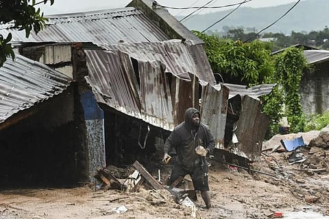 A man stands outside his damaged home in Blantyre, Malawi, Monday, March 13, 2023. (Photo | AP)