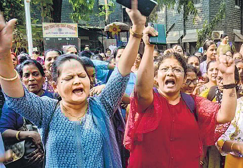 Maharashtra government employees raise slogans during a protest demanding restoration of old pension scheme, in Thane, on Tuesday | pti