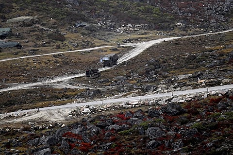 An Indian Army truck drives along a road to Tawang, near the Line of Actual Control (LAC), neighbouring China, near Sela Pass in Arunachal Pradesh state, October 21, 2021. (Photo | AFP)
