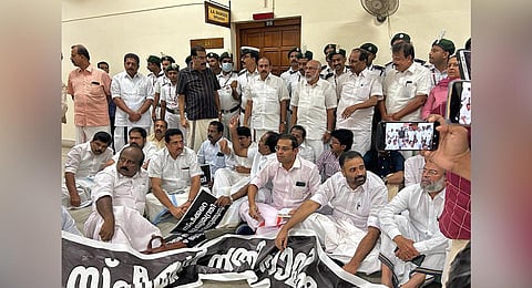 Opposition MLAs staging protest in front of the Speakers office at the assembly complex on Wednesday. (Photo | Express)