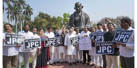 MPs of AAP and BRS stage a protest demanding joint parliamentary committee (JPC) probe into Adani row during the Budget Session of Parliament. (Photo | PTI)