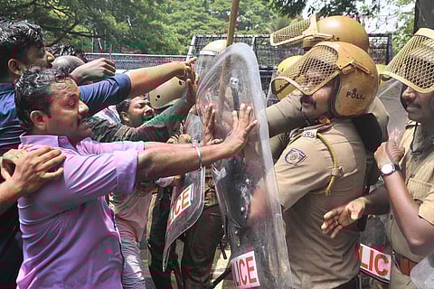 The scuffle between police and Youth Congress workers in front of the assembly during the protest march against handcuffing Opposition MLAs in the House. (Photo | B P Deepu, EPS)