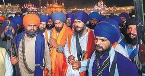 Amritpal Singh with his aide Lovepreet Singh Toofan at the Golden Temple after the latter’s release from the Amritsar Central Jail. (File Photo | PTI)
