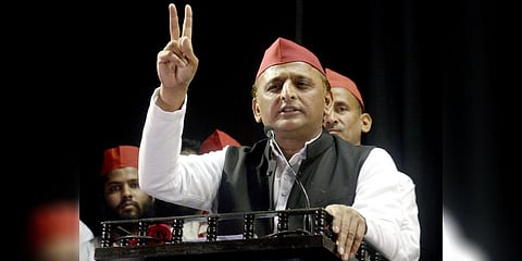 Samajwadi Party (SP) President Akhilesh Yadav addresses while showing a victory sign at the party's National Executive meeting, in Kolkata, March. 17, 2023. (Photo | ANI)