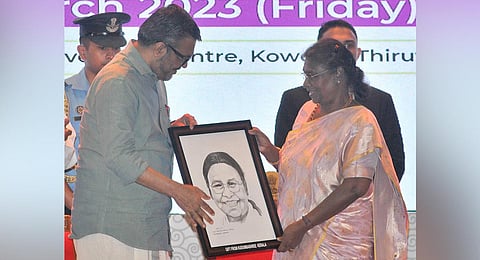 LSG Minister M B Rajesh presenting President Droupadi Murmu with her portrait created by Aju V J, a BUDS school student.(Photo | B P Deepu, EPS)