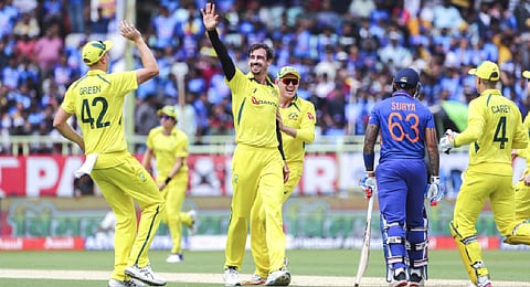 Australia's Mitchell Starc, center, celebrates the wicket of India's Suryakumar Yadav during the second one-day international cricket match between India and Australia. (Photo | AP)