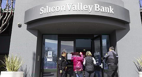 Security guards let individuals enter the Silicon Valley Bank's headquarters in Santa Clara, Calif. (File photo | AP)